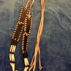 Used black Bebe black leather belt. Size large.